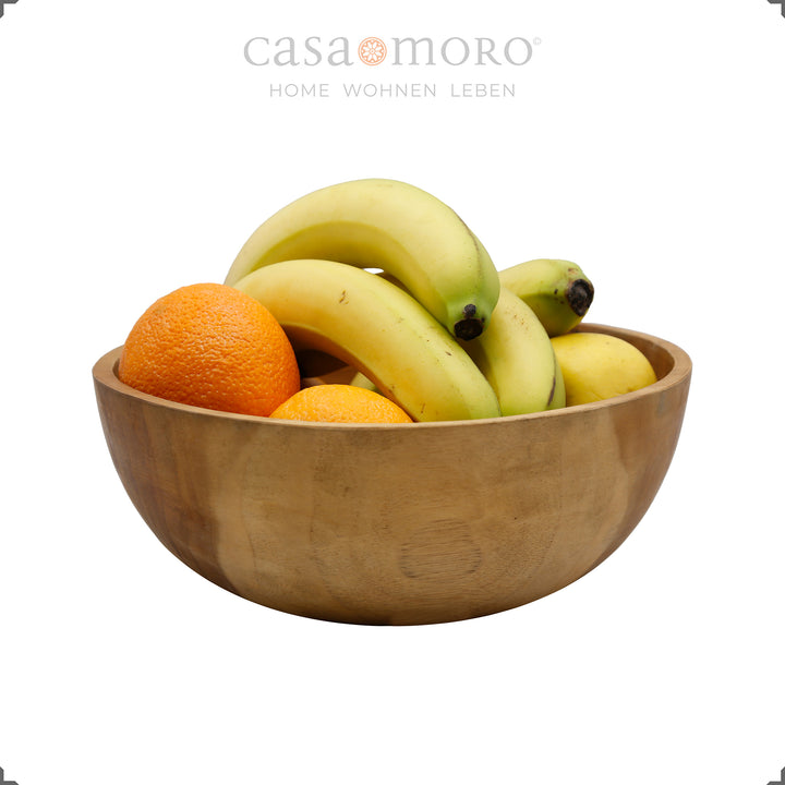 Obstschale aus naturbelassenem Teakholz mit Früchten befüllt